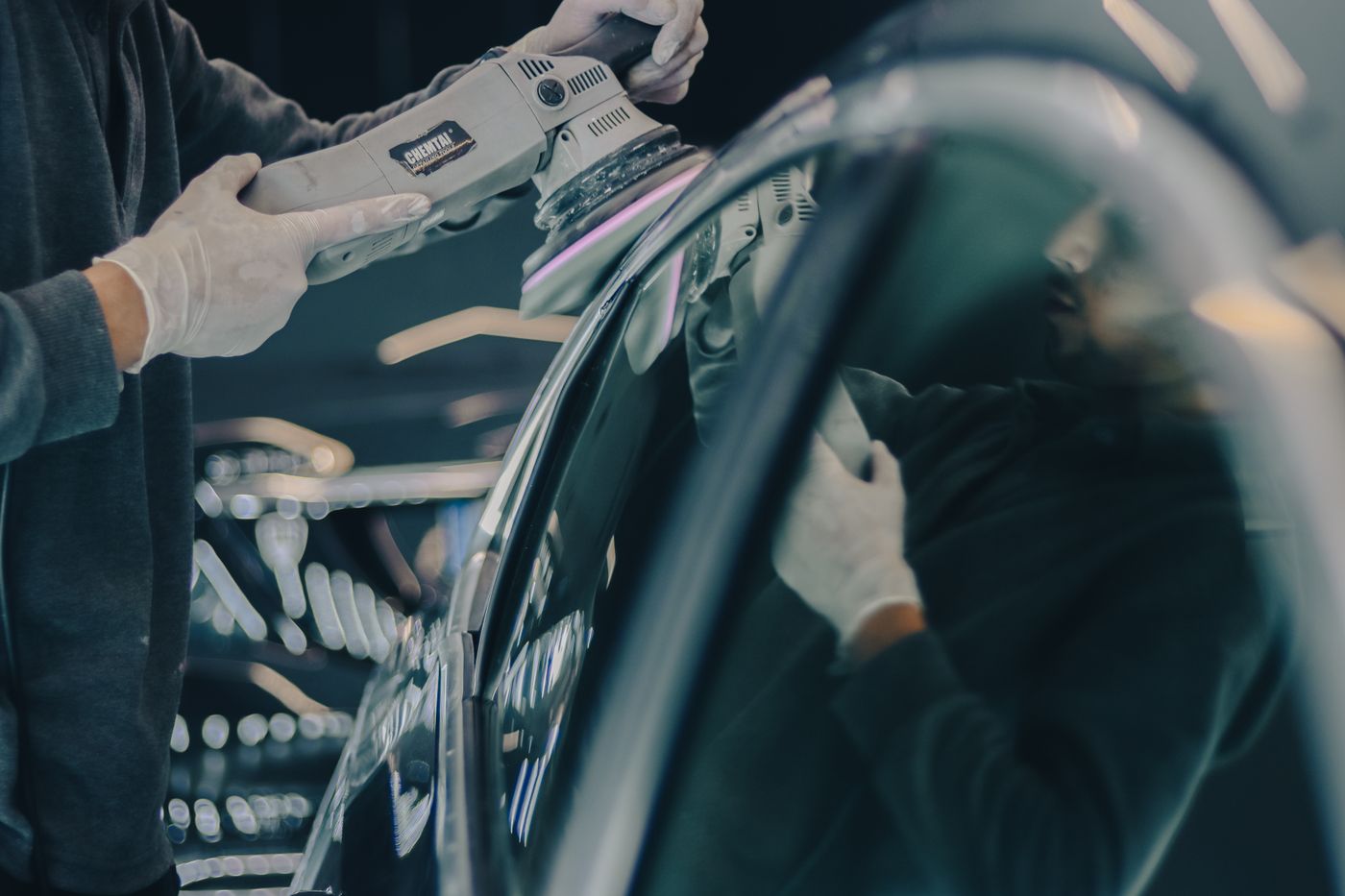 A car panel being machine polished